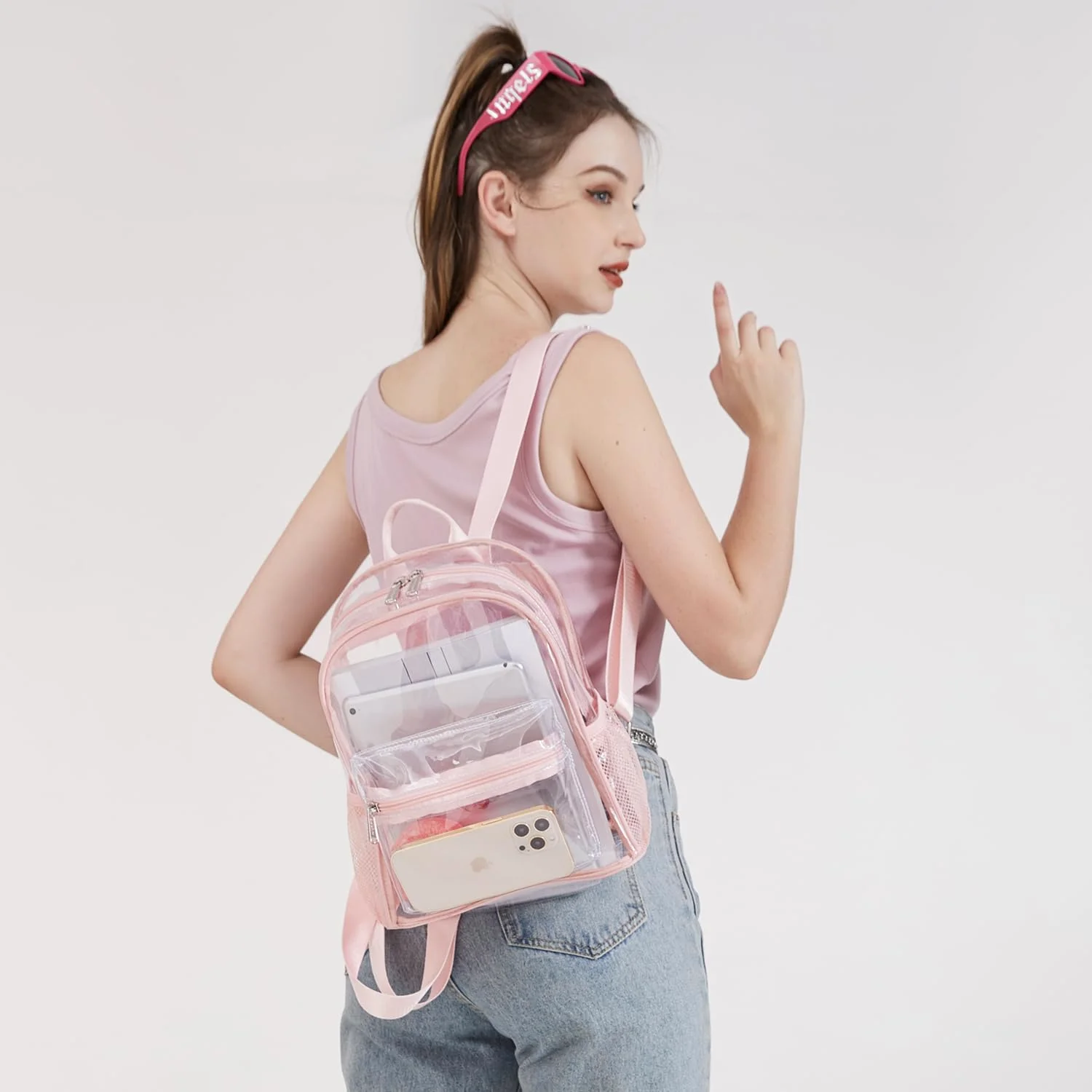 The 12 by 12 by 6-inch stadium backpack in pink, worn
